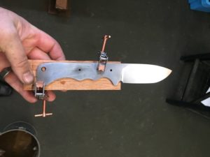Attach wood to steel to create he handle