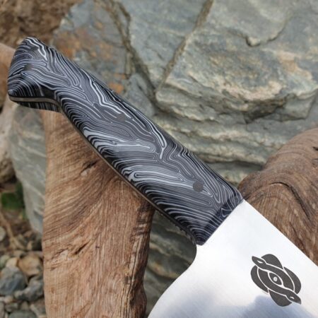 Close up of a knife handle made using G10 damascus handle scales black white