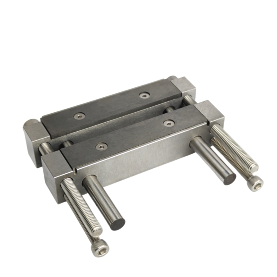 Pair of compensation screws threaded into the file guide from the back. These screws apply pressure at the bottom edge of the file guide, countering twisting of the guide body. 